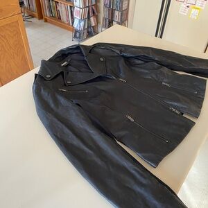 DKNY black leather jacket with nylon side panels.
